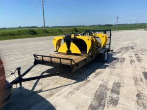 Tow trailer with grapple